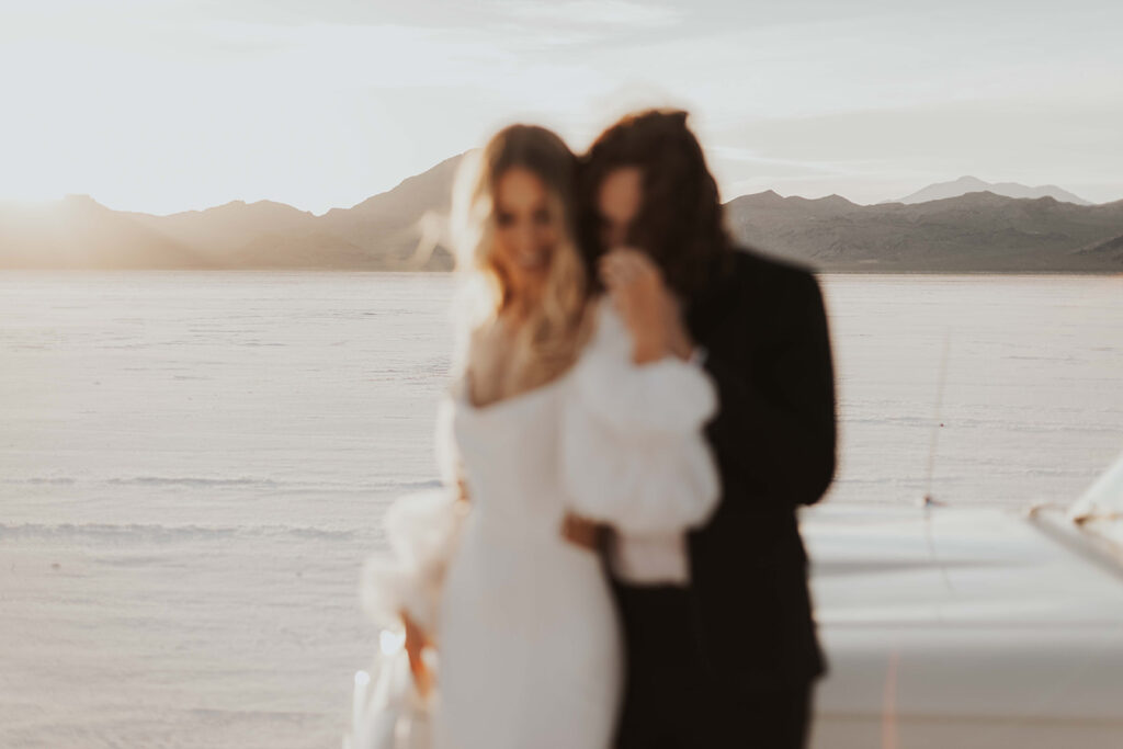 romantic & blurry bride and groom close up photo during their bonneville salt flats elopement day