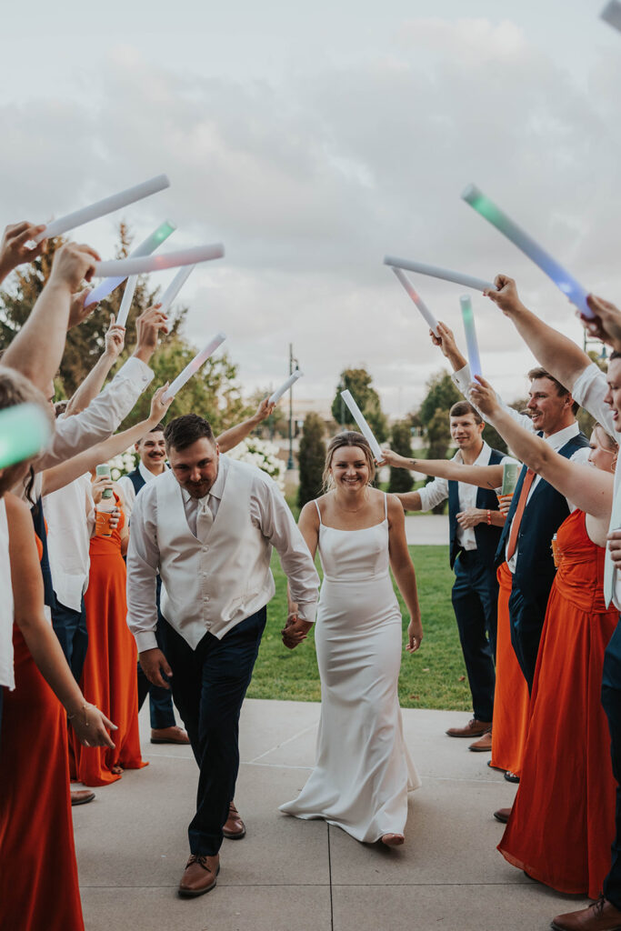 bride and groom wedding exit from prairie winds event center