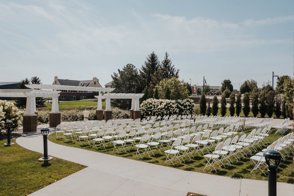 classy and elegant outdoor wedding ceremony set up at prairie winds event center