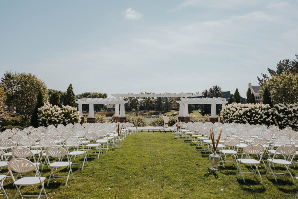 classy and elegant outdoor wedding ceremony set up at prairie winds event center