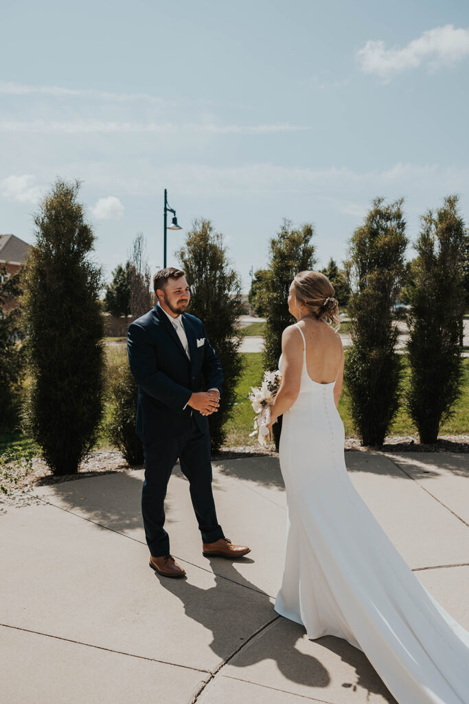 bride and groom emotional first look