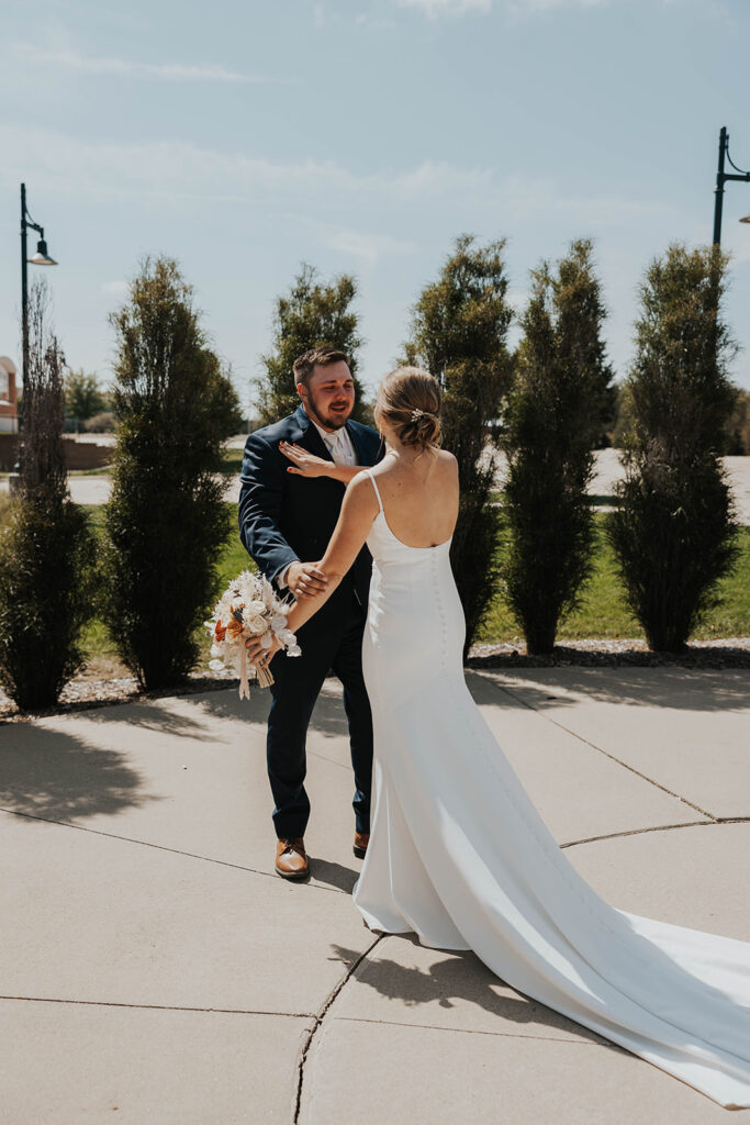 bride and groom emotional first look