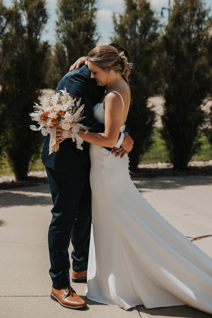 bride and groom emotional first look