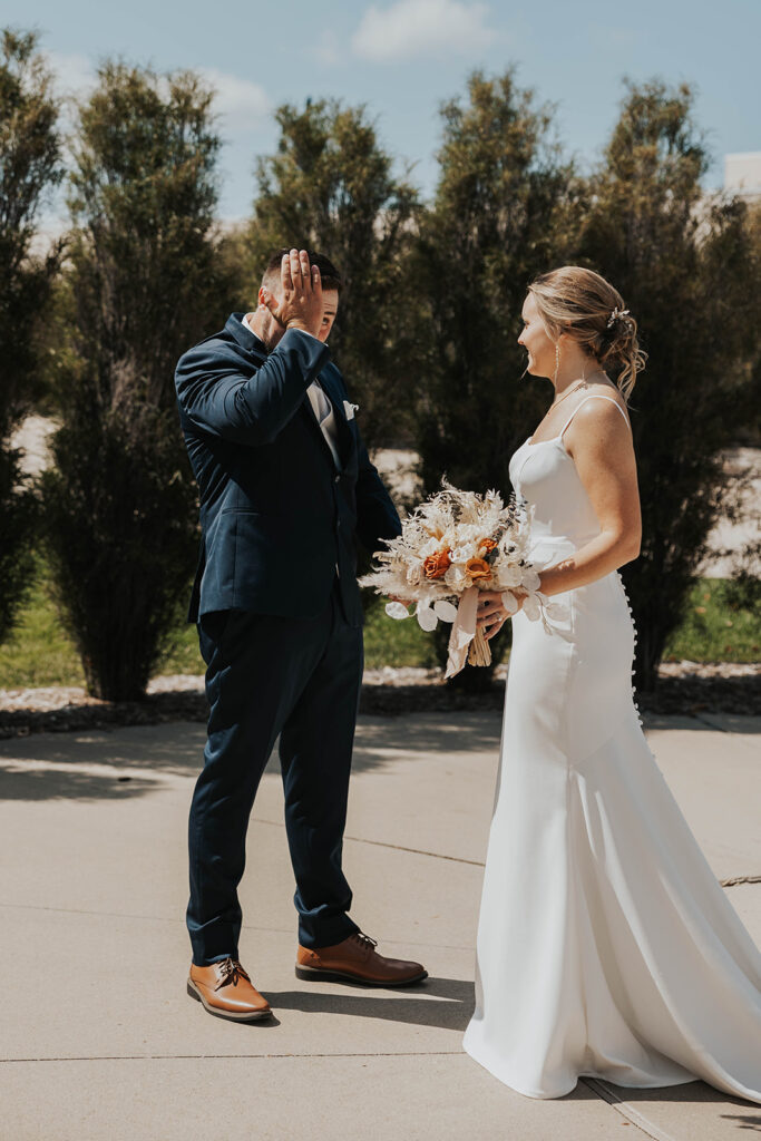 bride and groom emotional first look