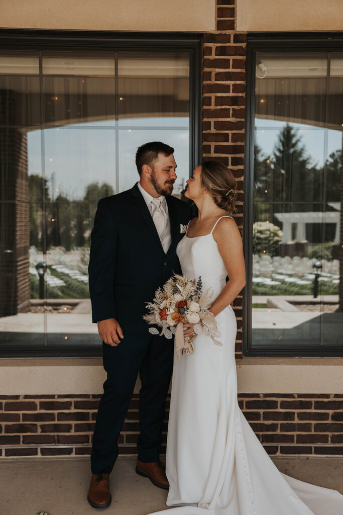 candid and romantic bride and groom portrait outdoors at prairie winds event center