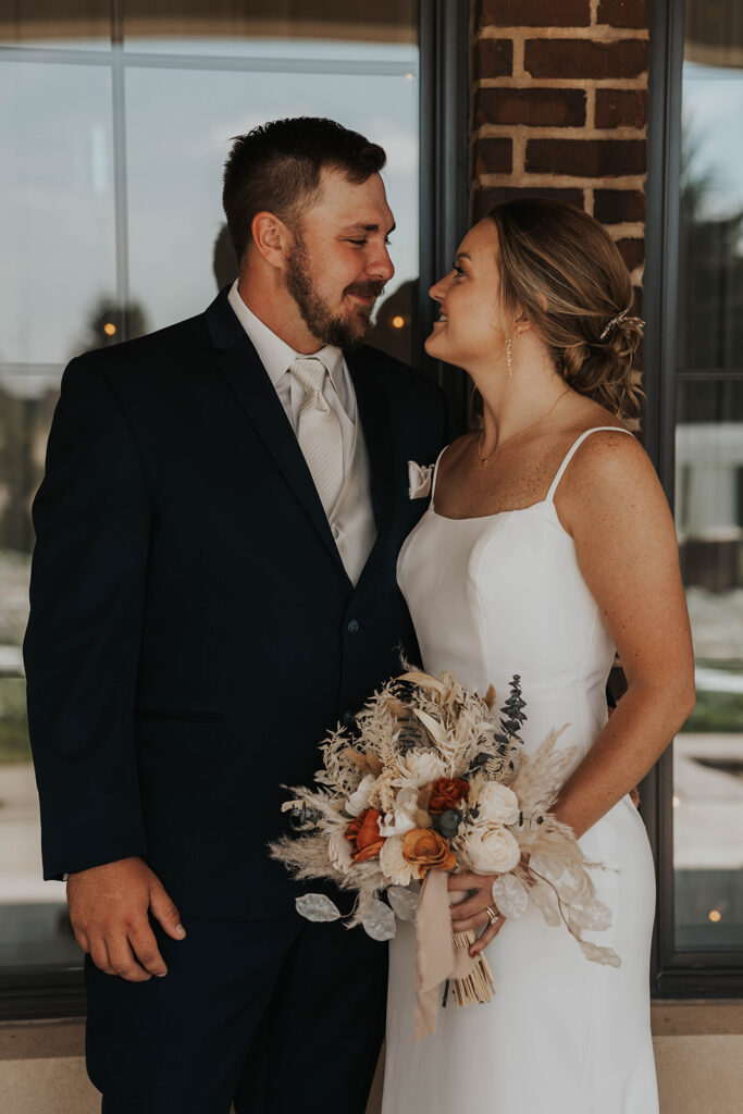 romantic bride and groom portrait at prairie winds event center