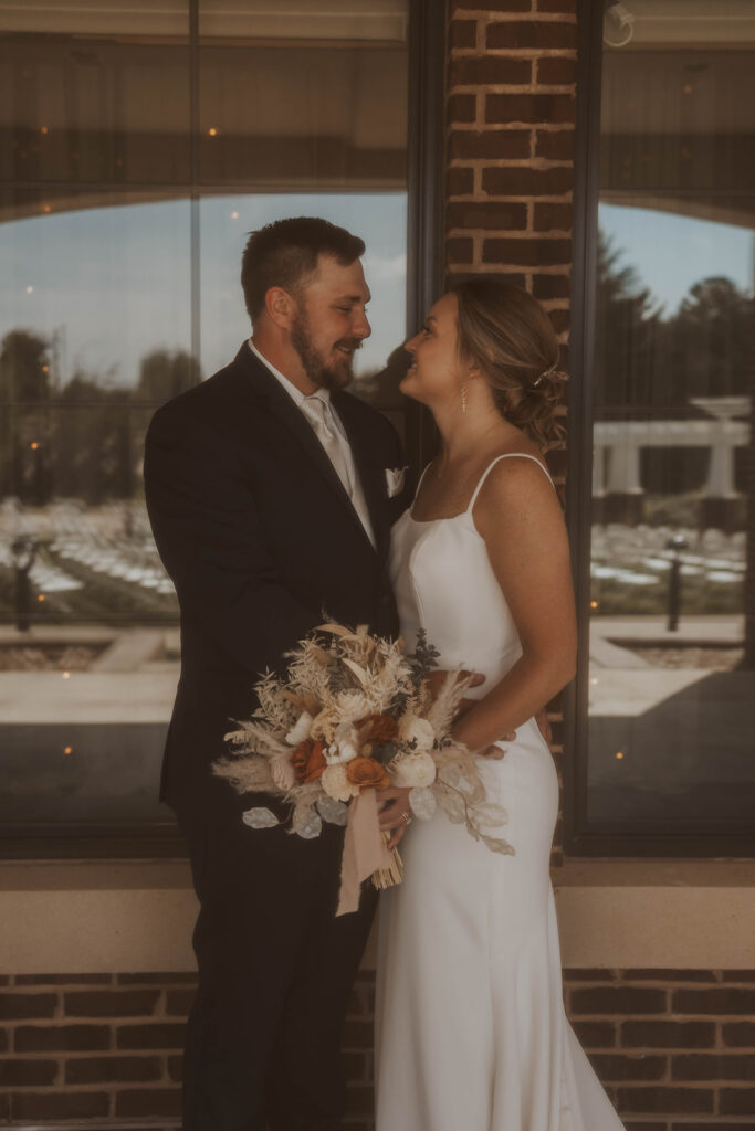 candid and romantic bride and groom portrait outdoors