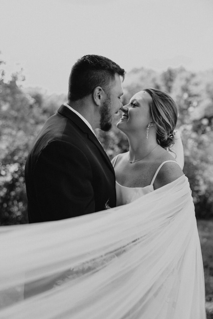 candid and romantic bride and groom portrait outdoors