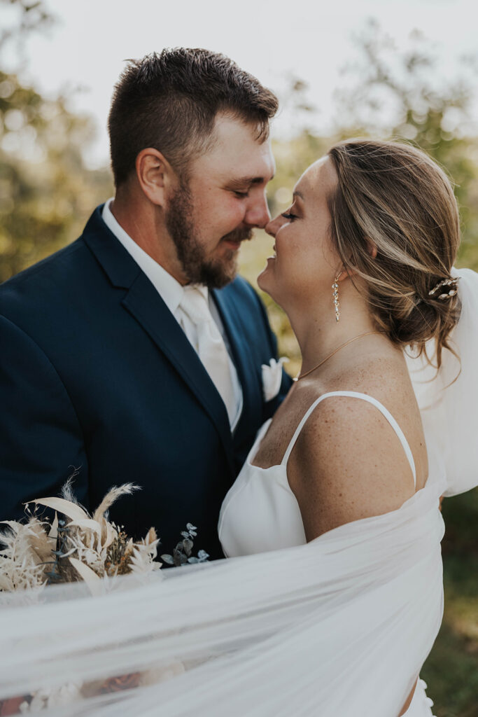 candid and romantic bride and groom portrait outdoors