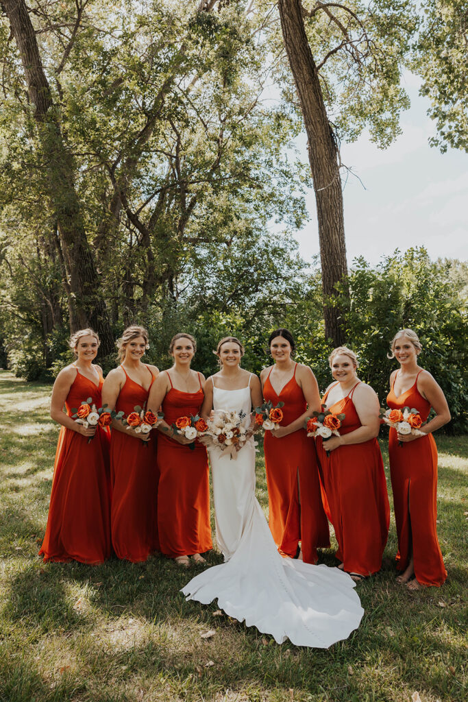 bride and bridesmaids, bridesmaids wearing red bridesmaid dresses