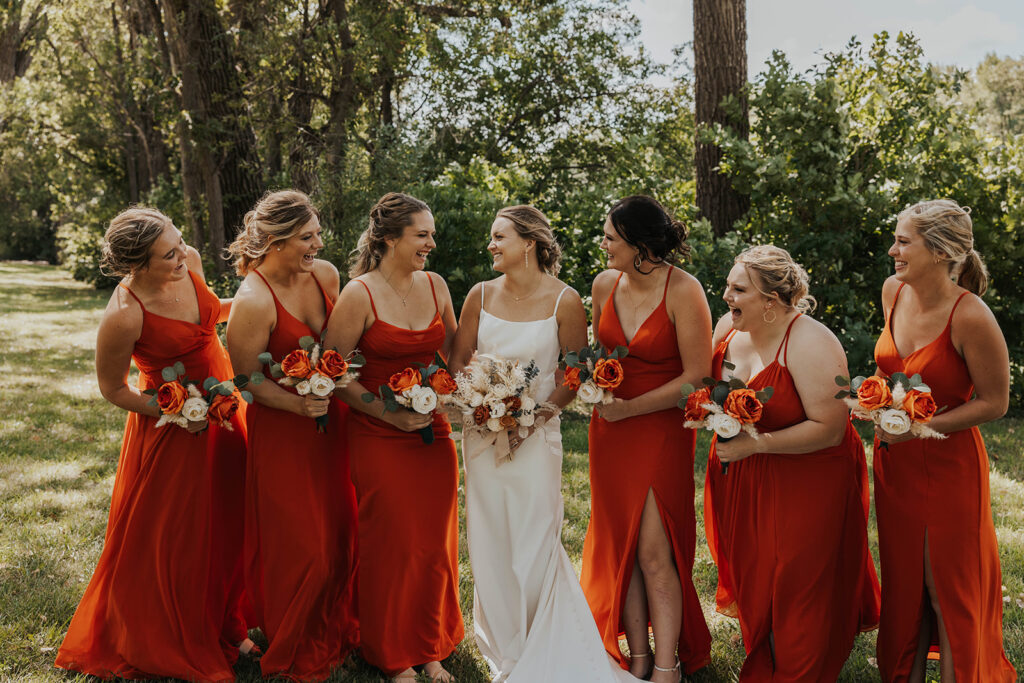 bride and bridesmaids, bridesmaids wearing red bridesmaid dresses