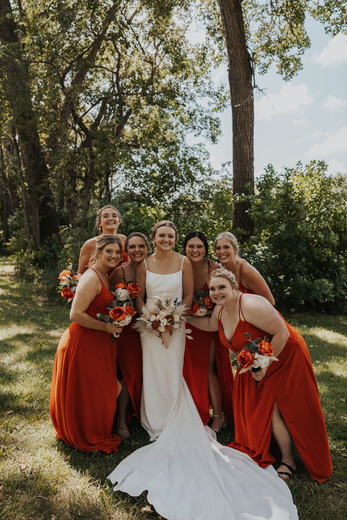 bride and bridesmaids, bridesmaids wearing red bridesmaid dresses