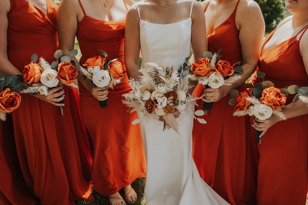 bride and bridesmaids, bridesmaids wearing red bridesmaid dresses