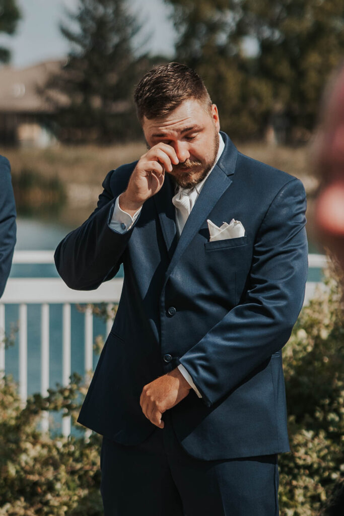 groom emotional during wedding ceremony