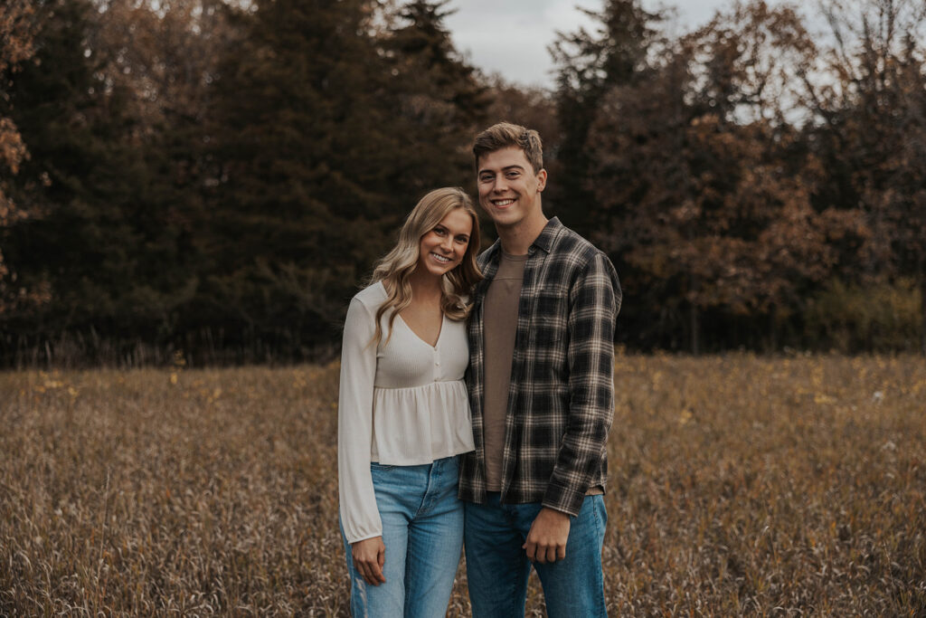 Tess and Cole posing together in a grassy field in Sioux Falls, SD