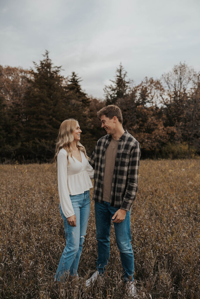 Tess and Cole posing together in a grassy field in Sioux Falls, SD