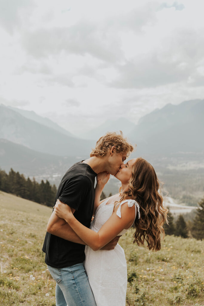 romantic banff engagement photos in a grassy field