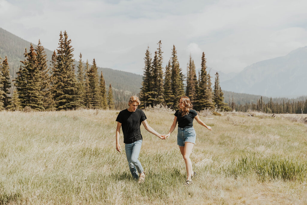 romantic and playful photo of Lauren and Caleb in Banff National Park