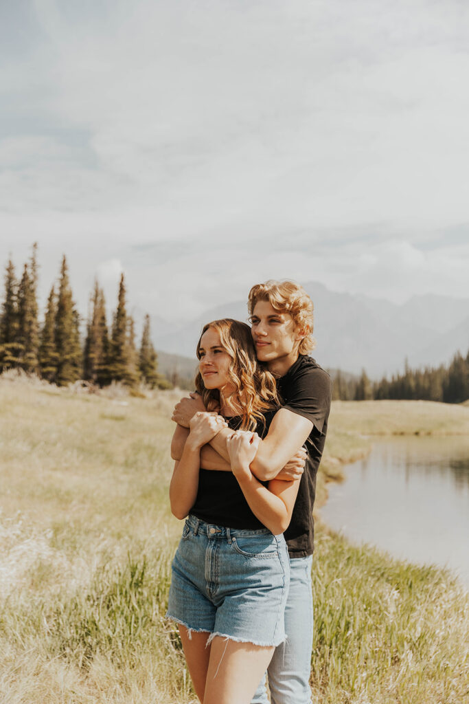 caleb hugging lauren from behind 