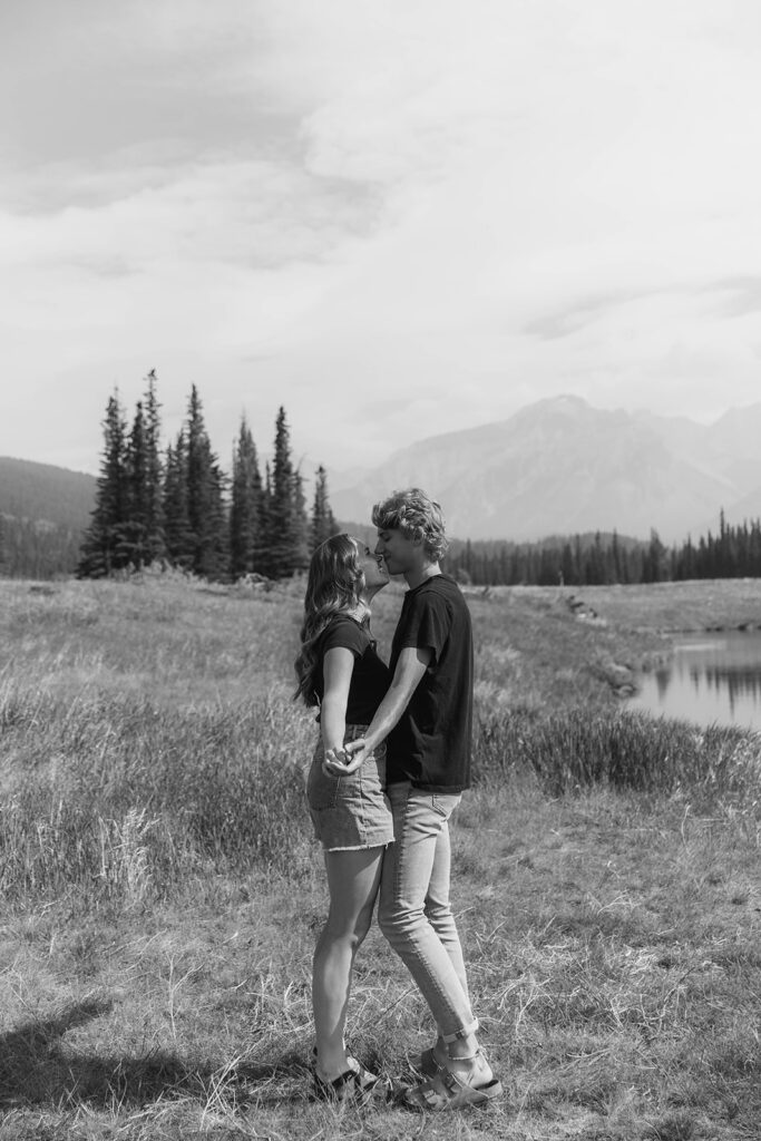 romantic and playful photo of Lauren and Caleb in Banff National Park