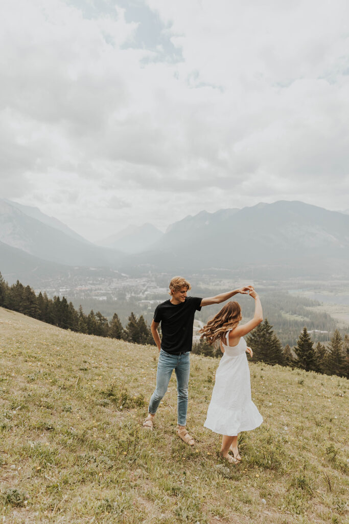 caleb and lauren wearing neutral engagement outfits for their banff engagement photos