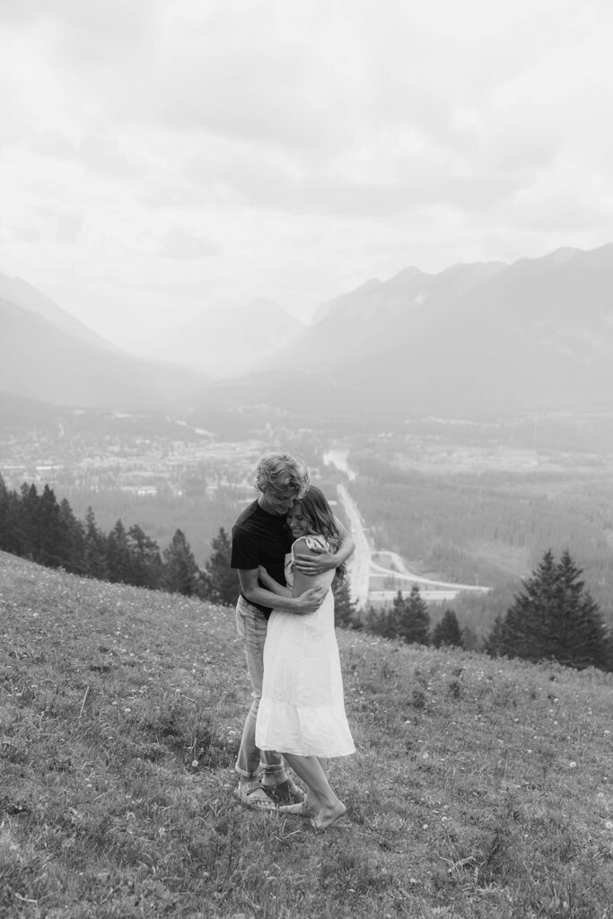 caleb and lauren wearing neutral engagement outfits for their banff engagement photos