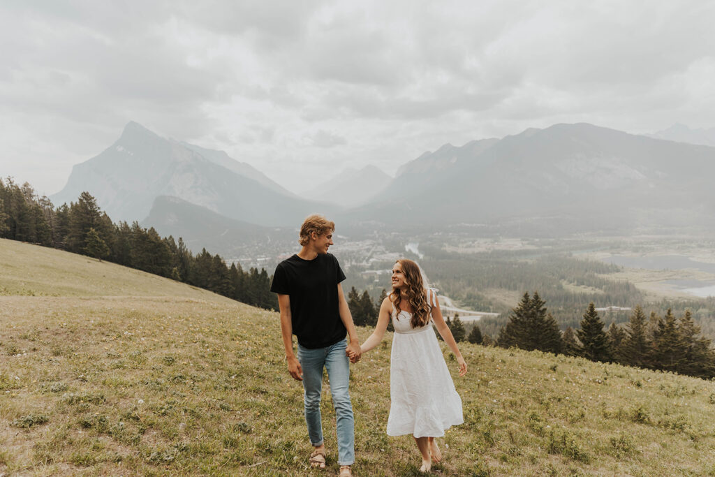 caleb and lauren wearing neutral engagement outfits for their banff engagement photos