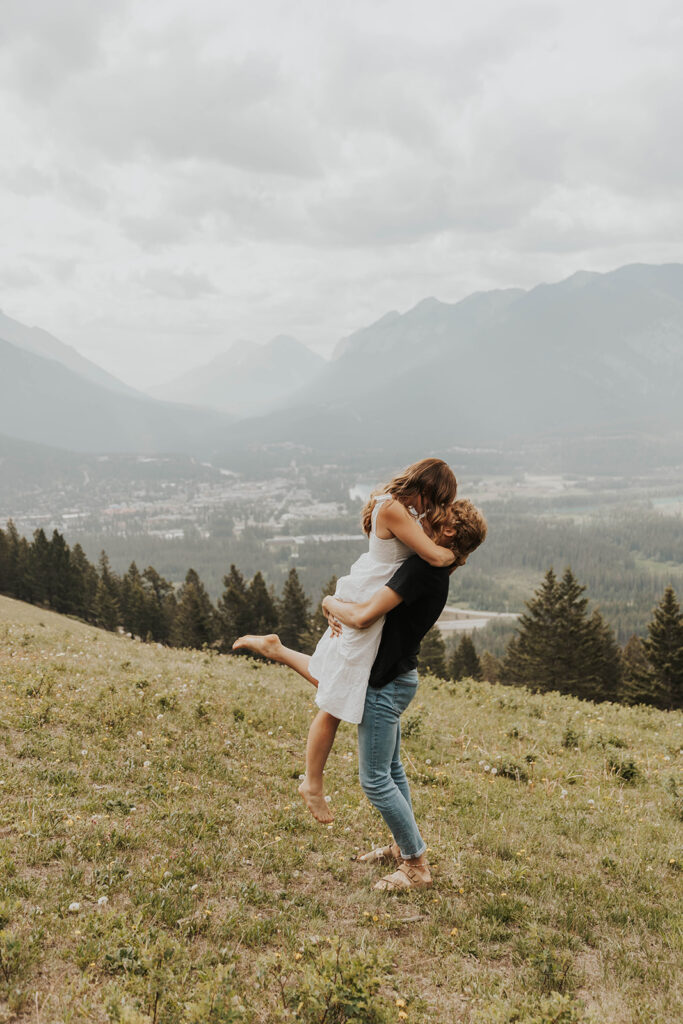 caleb and lauren wearing neutral engagement outfits for their banff engagement photos