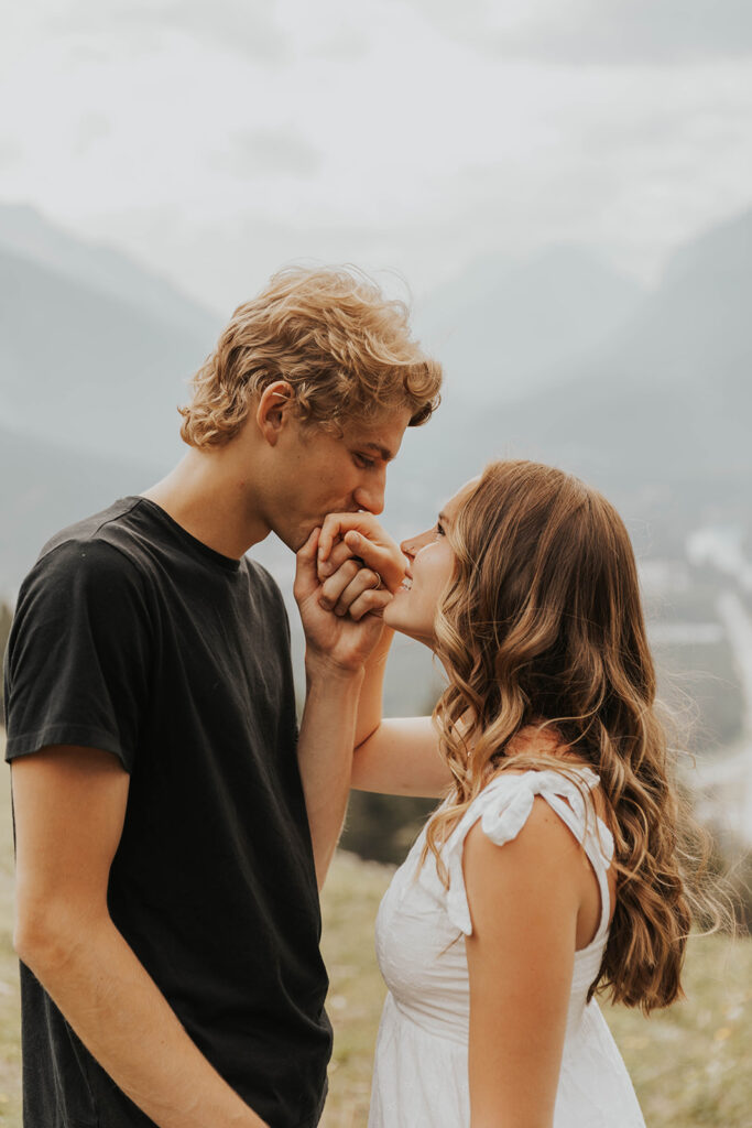 caleb and lauren wearing neutral engagement outfits for their banff engagement photos