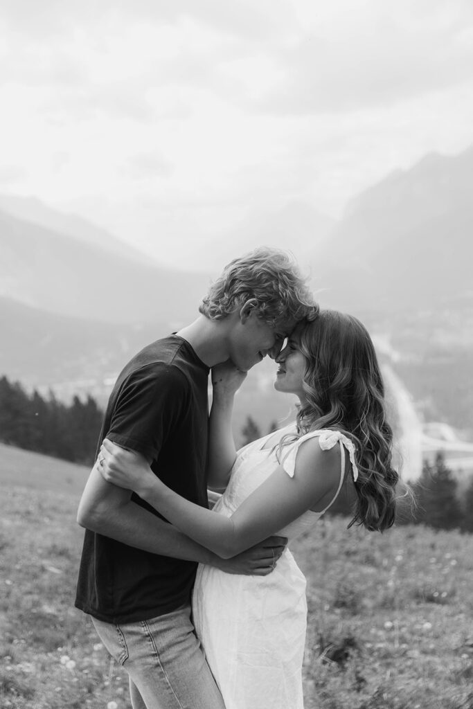 caleb and lauren wearing neutral engagement outfits for their banff engagement photos