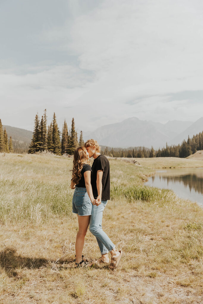 romantic and playful photo of Lauren and Caleb in Banff National Park