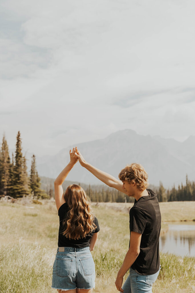 romantic and playful photo of Lauren and Caleb in Banff National Park