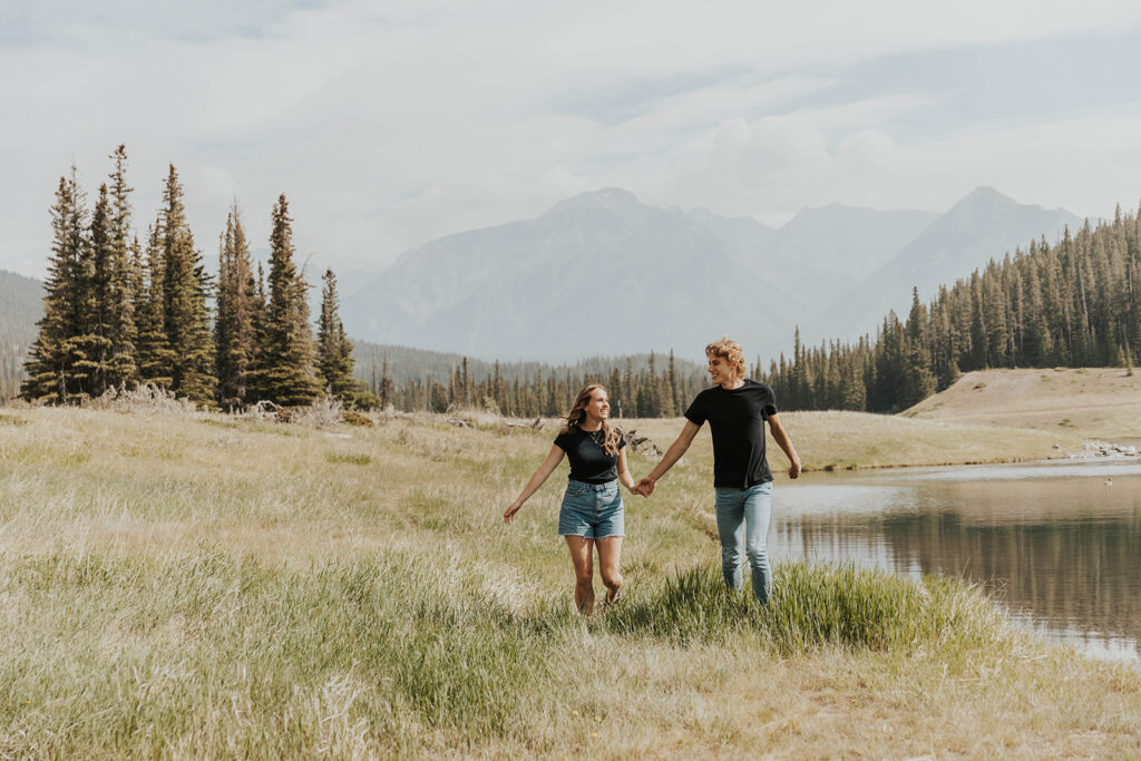 romantic and playful photo of Lauren and Caleb in Banff National Park