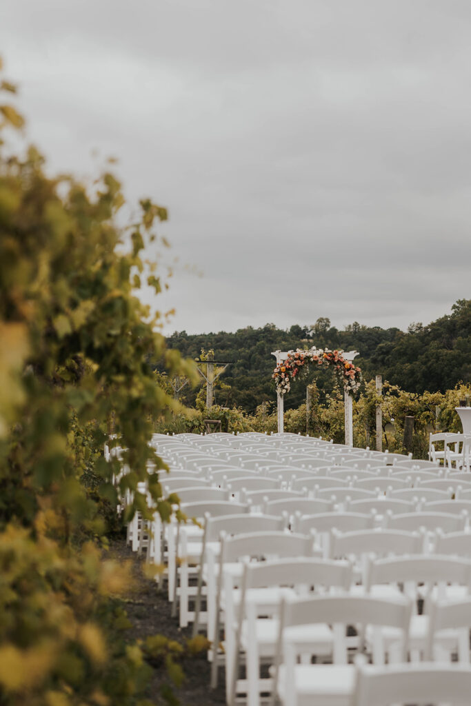 outdoor wedding ceremony setup in a vineyard at willow brooke farm