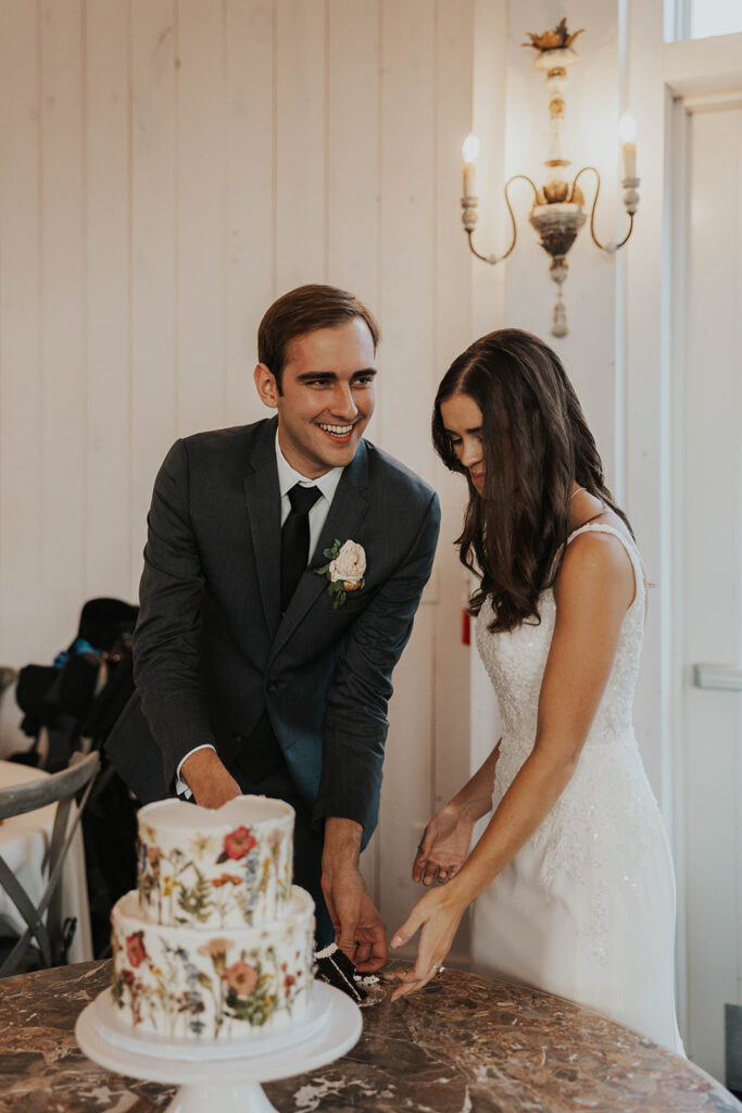 bride and groom cutting their cake