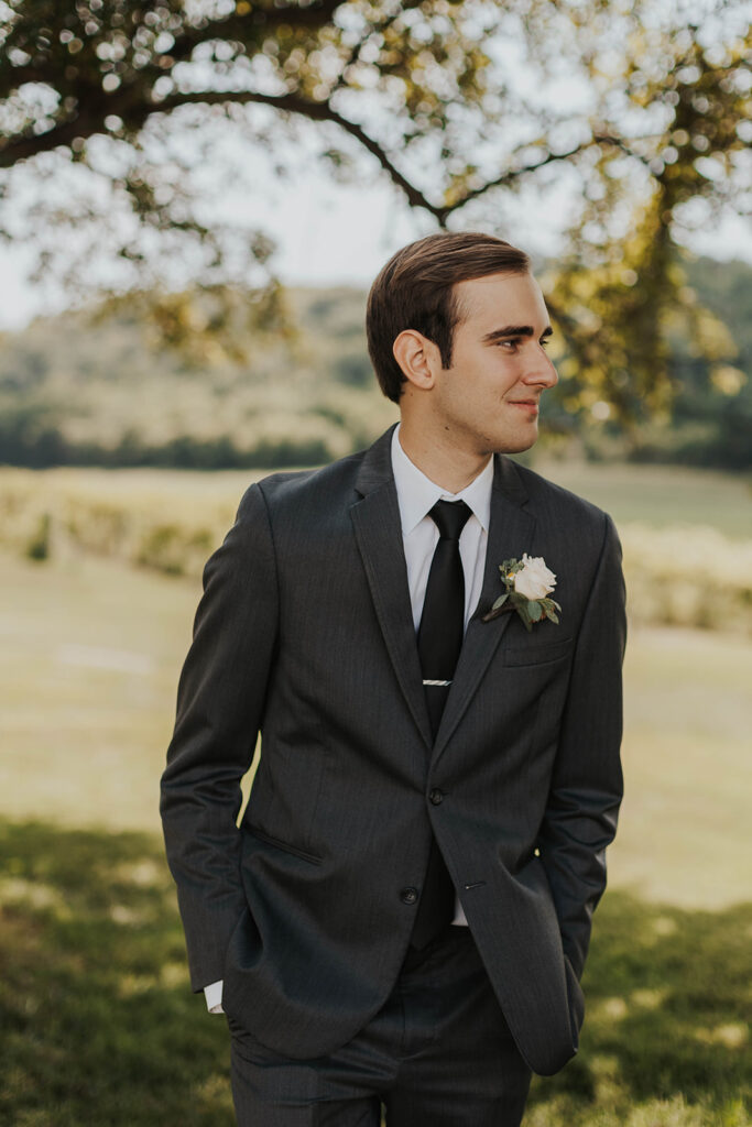 groom portrait in a gorgeous green vineyard