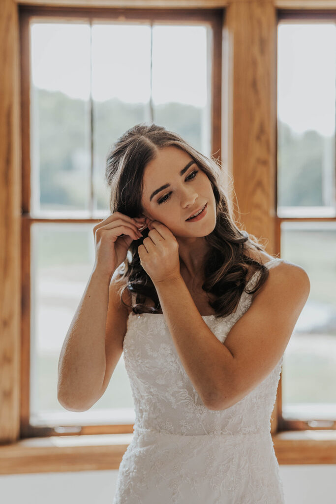 bride getting ready in a cozy, neutral color room