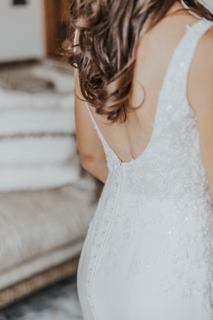 bride getting ready in a cozy, neutral color room