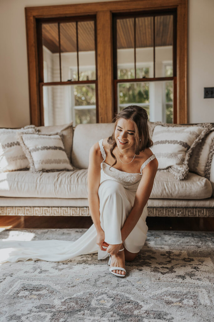 bride getting ready in a cozy, neutral color room