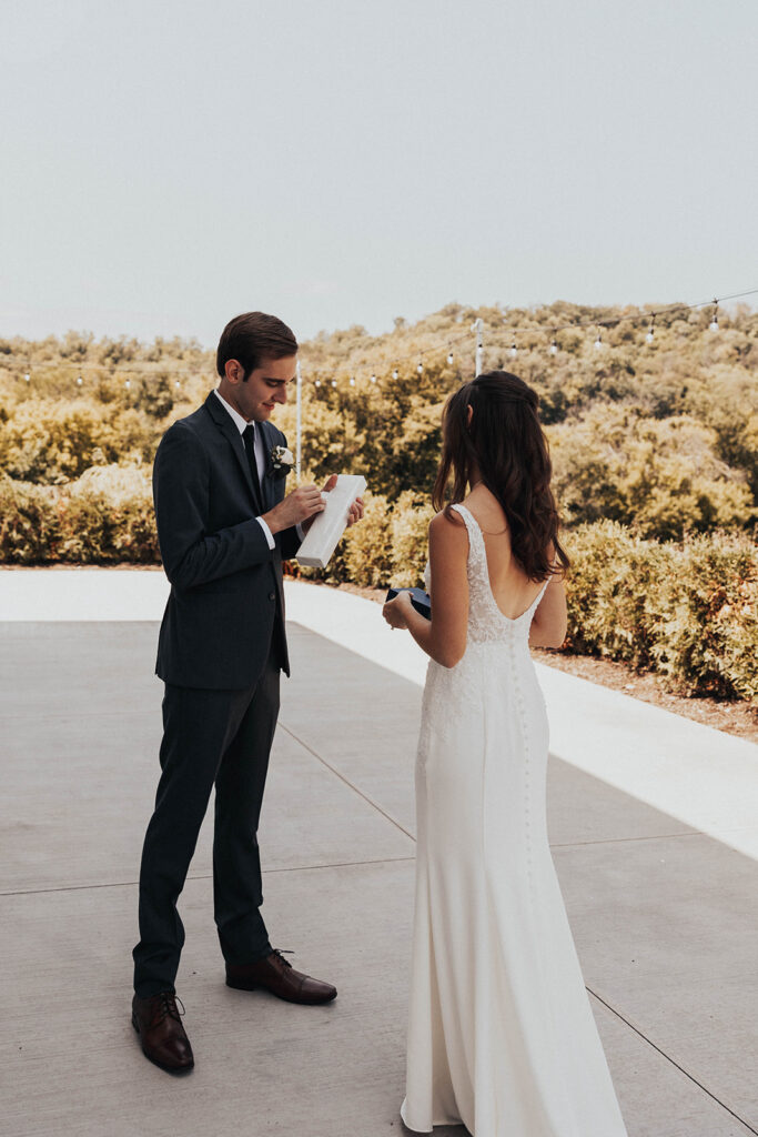 bride and groom exchanging private vows during first look