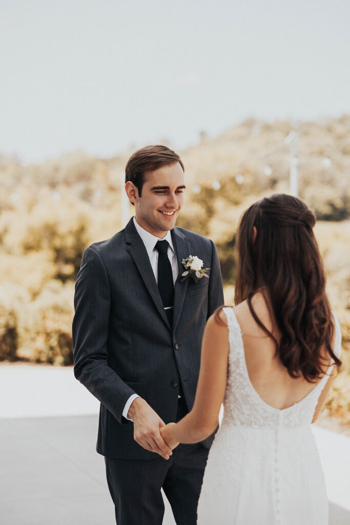 bride and groom exchanging private vows during first look