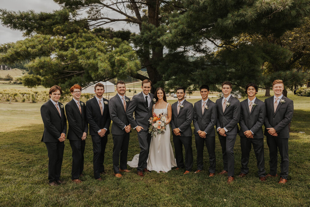 the newly weds with the groomsmen