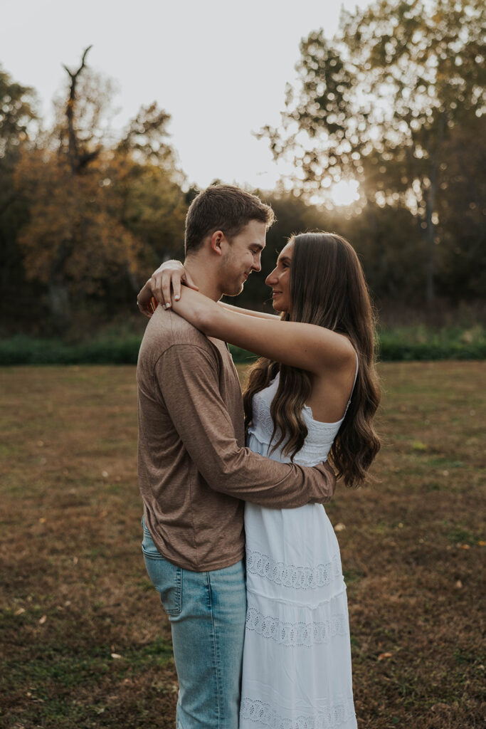 romantic outdoor engagement session, couple wearing neutral outfits