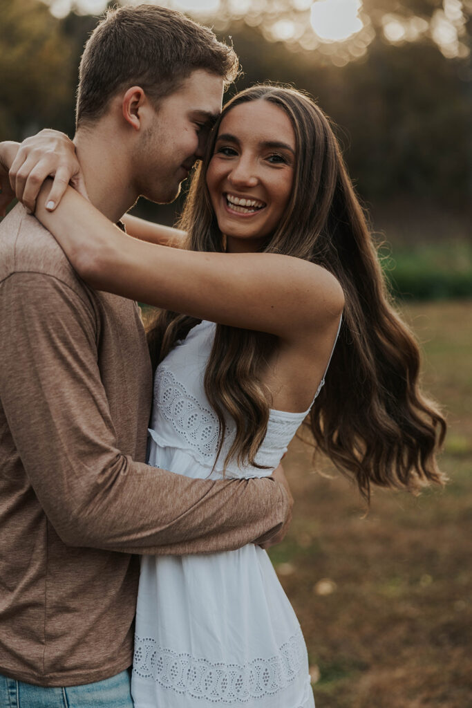 romantic outdoor engagement session, couple wearing neutral outfits