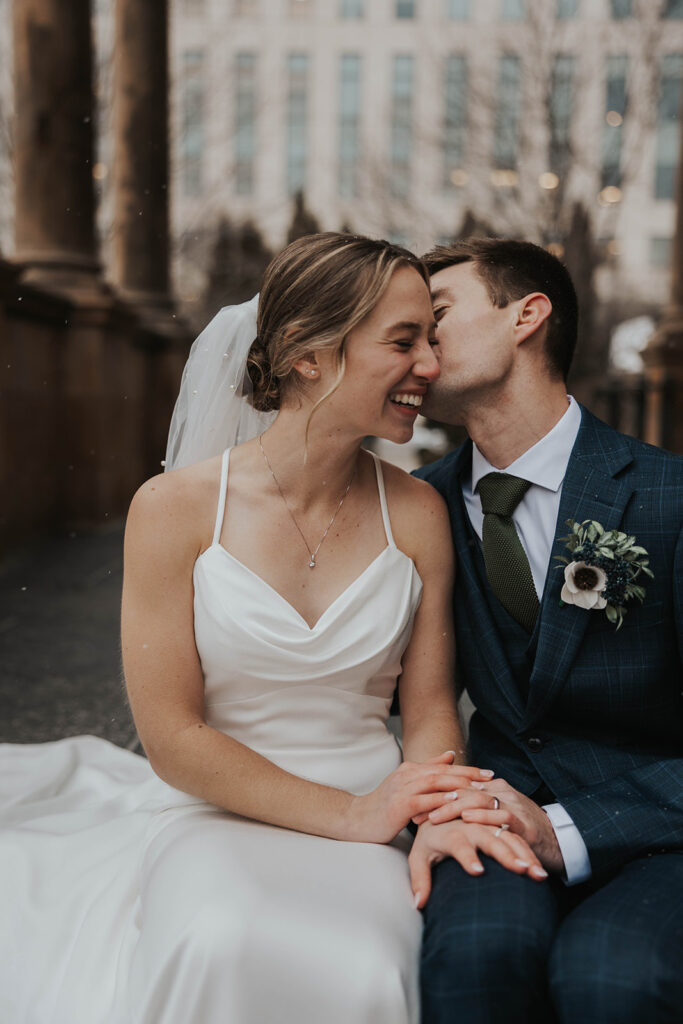 bride and groom outdoor wedding portraits in the city during their winter wedding day