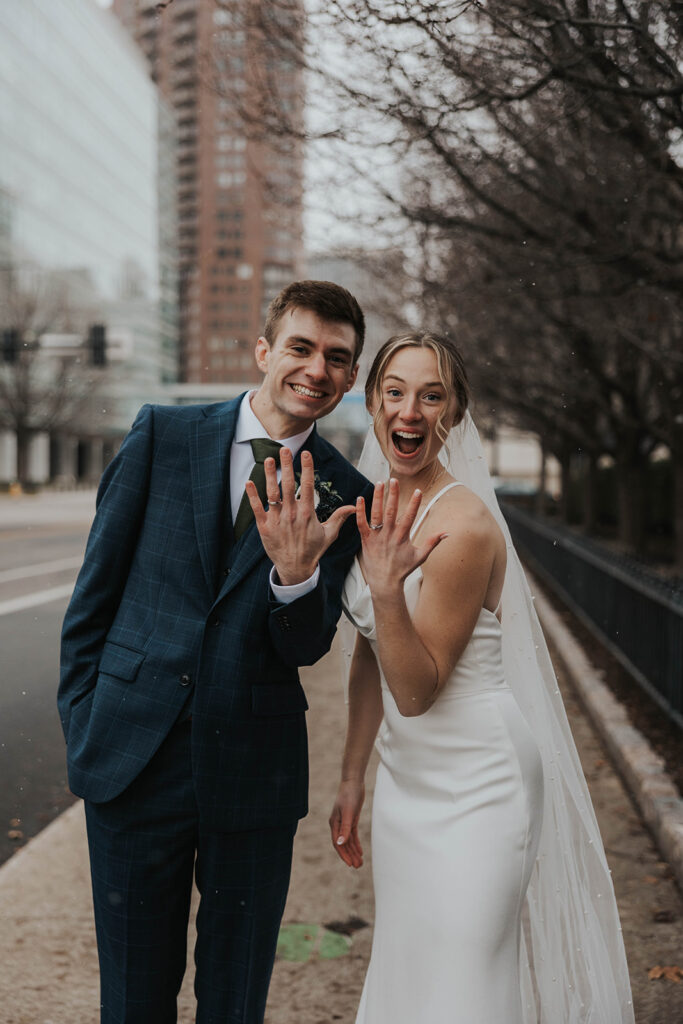 bride and groom outdoor wedding portraits in the city during their winter wedding day