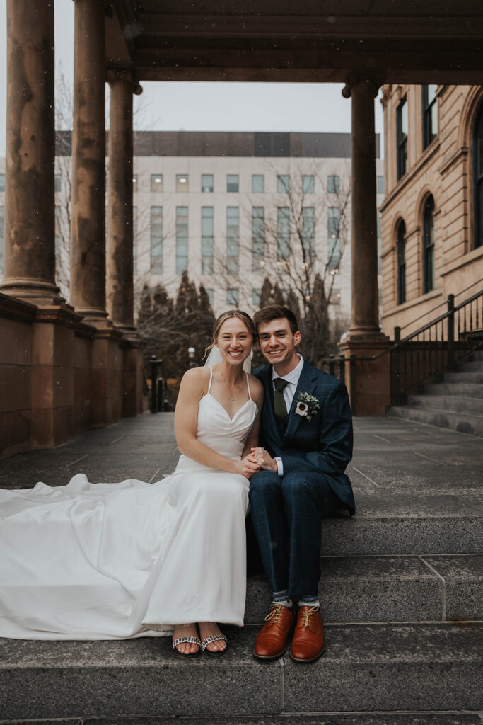 bride and groom outdoor wedding portraits in the city during their winter wedding day