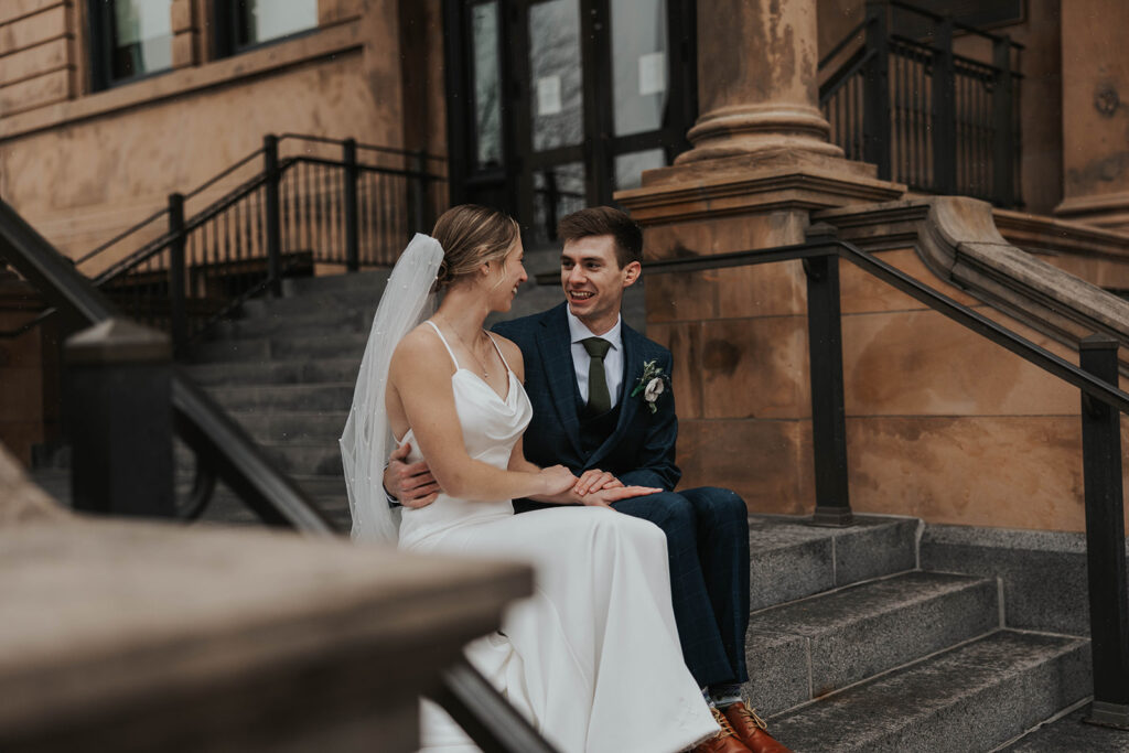 bride and groom outdoor wedding portraits in the city during their winter wedding day