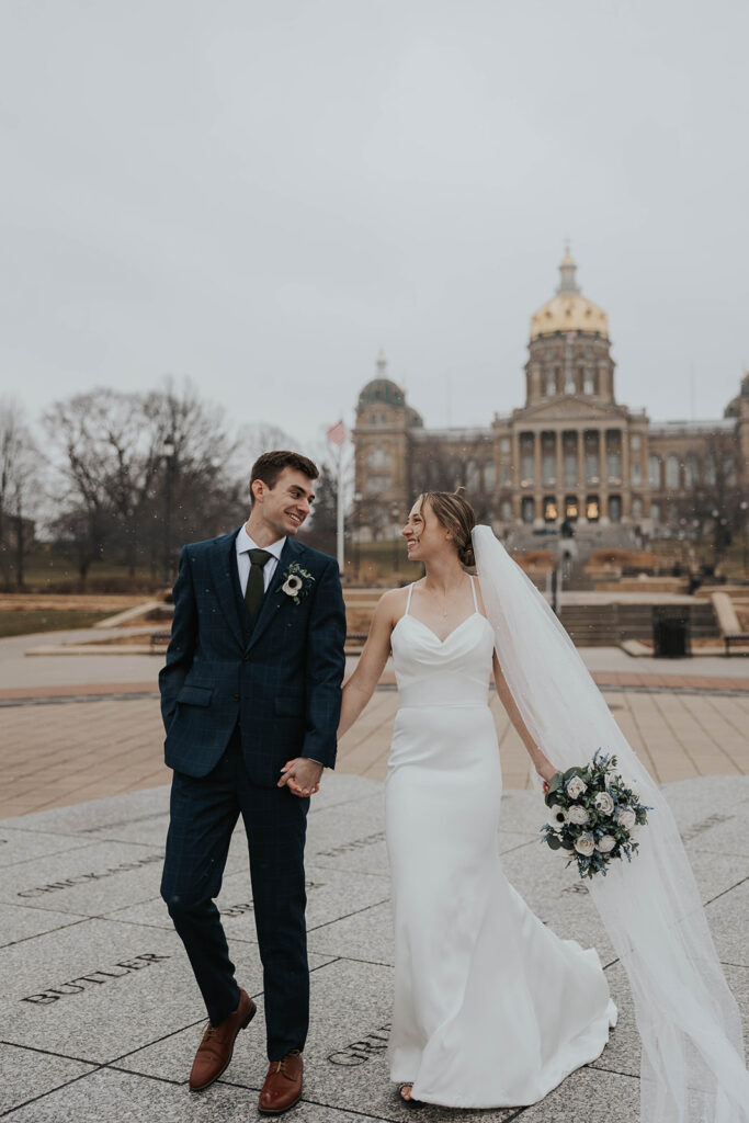 bride and groom outdoor wedding portraits in the city during their winter wedding day