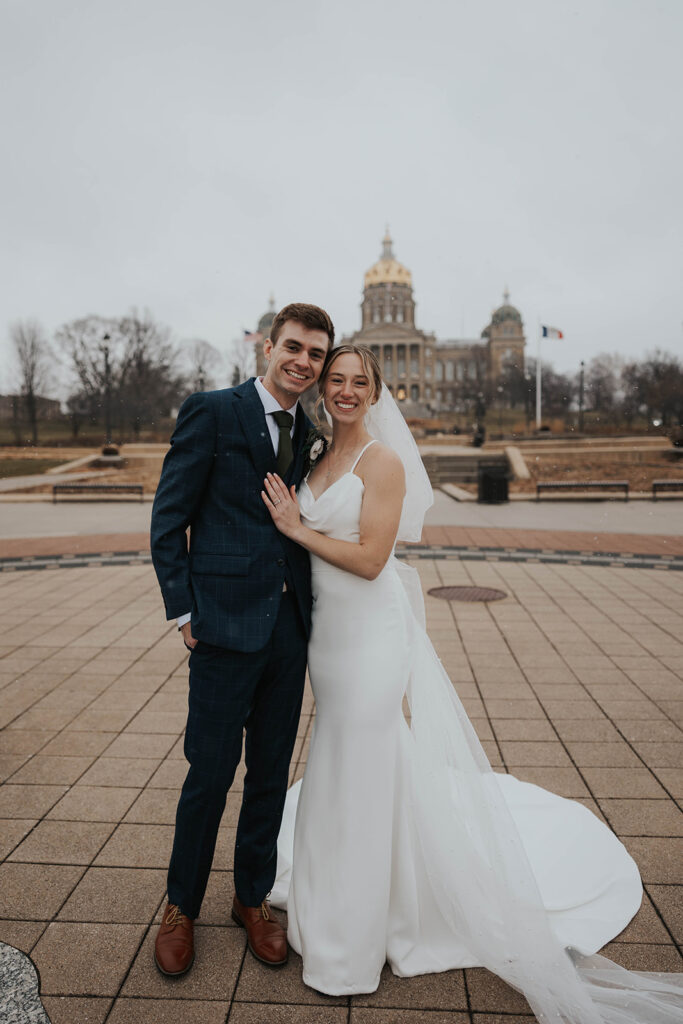 bride and groom outdoor wedding portraits in the city during their winter wedding day